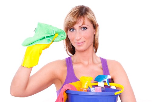 Technician applying cleaning solution with protective gear